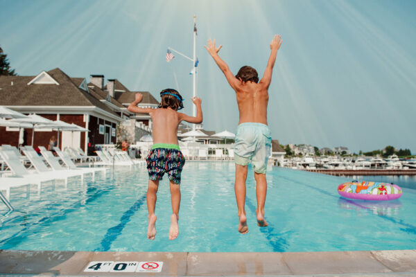 Kids Jumping into Pool